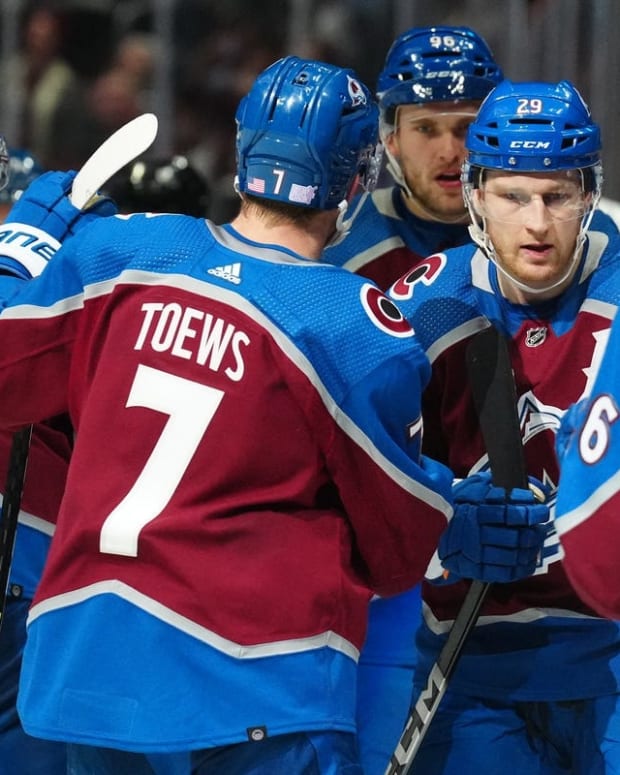 Nov 12, 2022; Denver, Colorado, USA; Colorado Avalanche center Nathan MacKinnon (29) celebrates his third period with teammates against the Carolina Hurricanes at Ball Arena. Mandatory Credit: Ron Chenoy-USA TODAY Sports